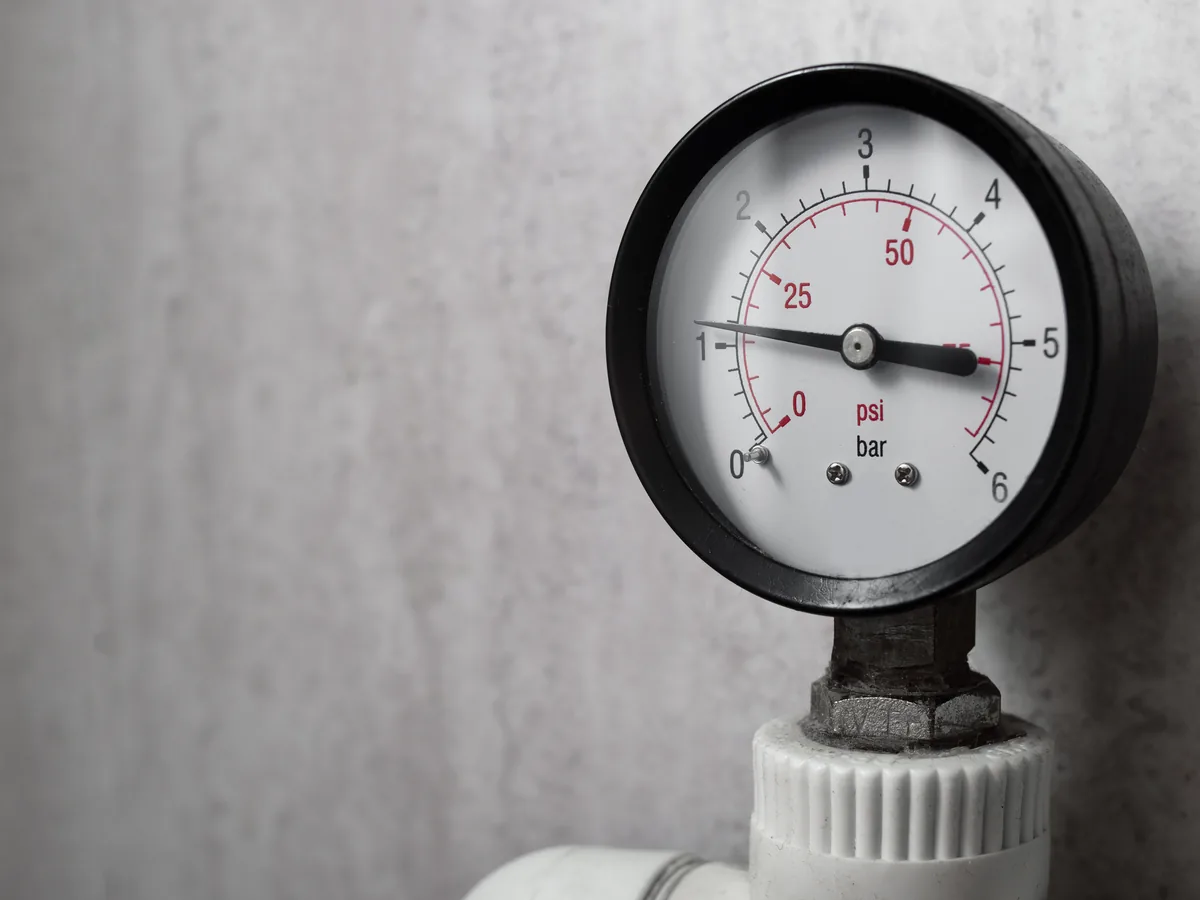 Pressure gauge on a boiler line read close up