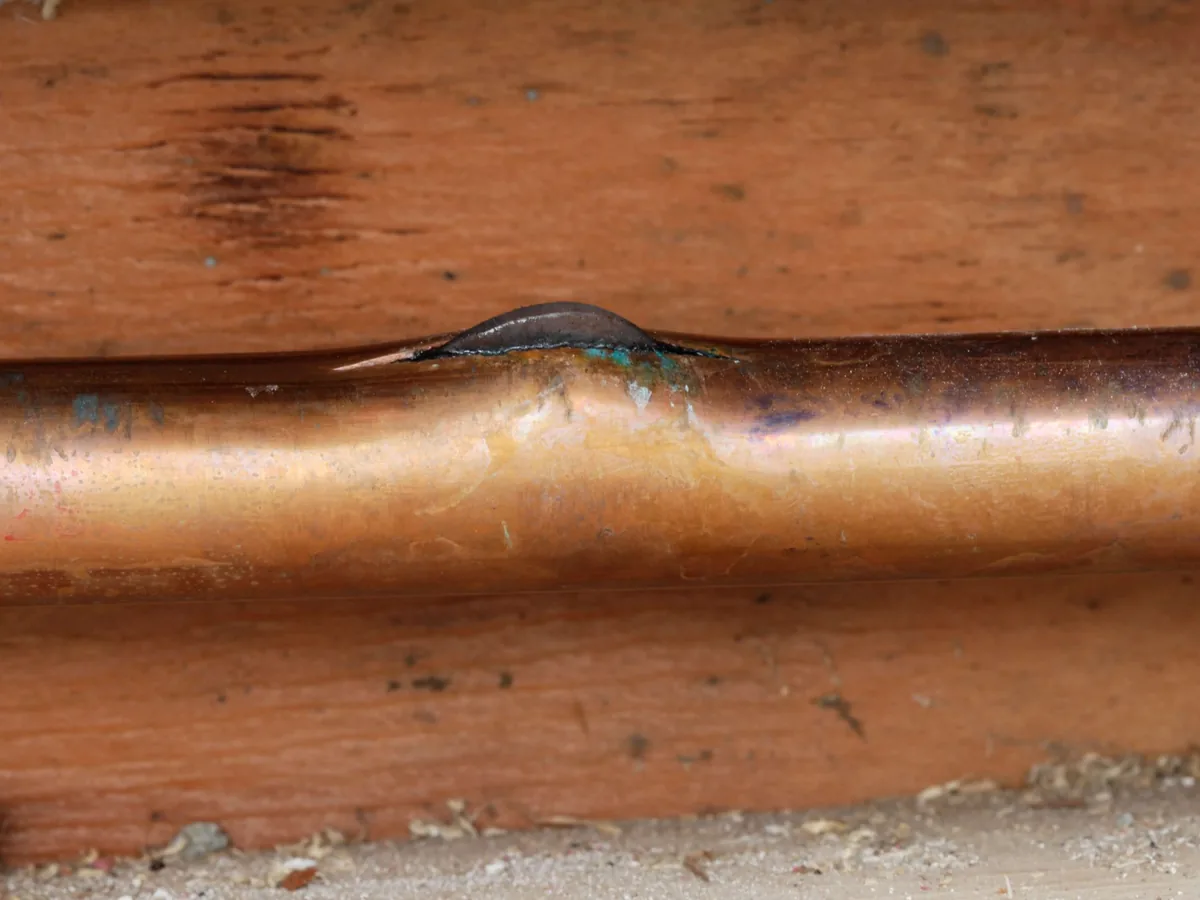 Copper water pipe split open by freezing